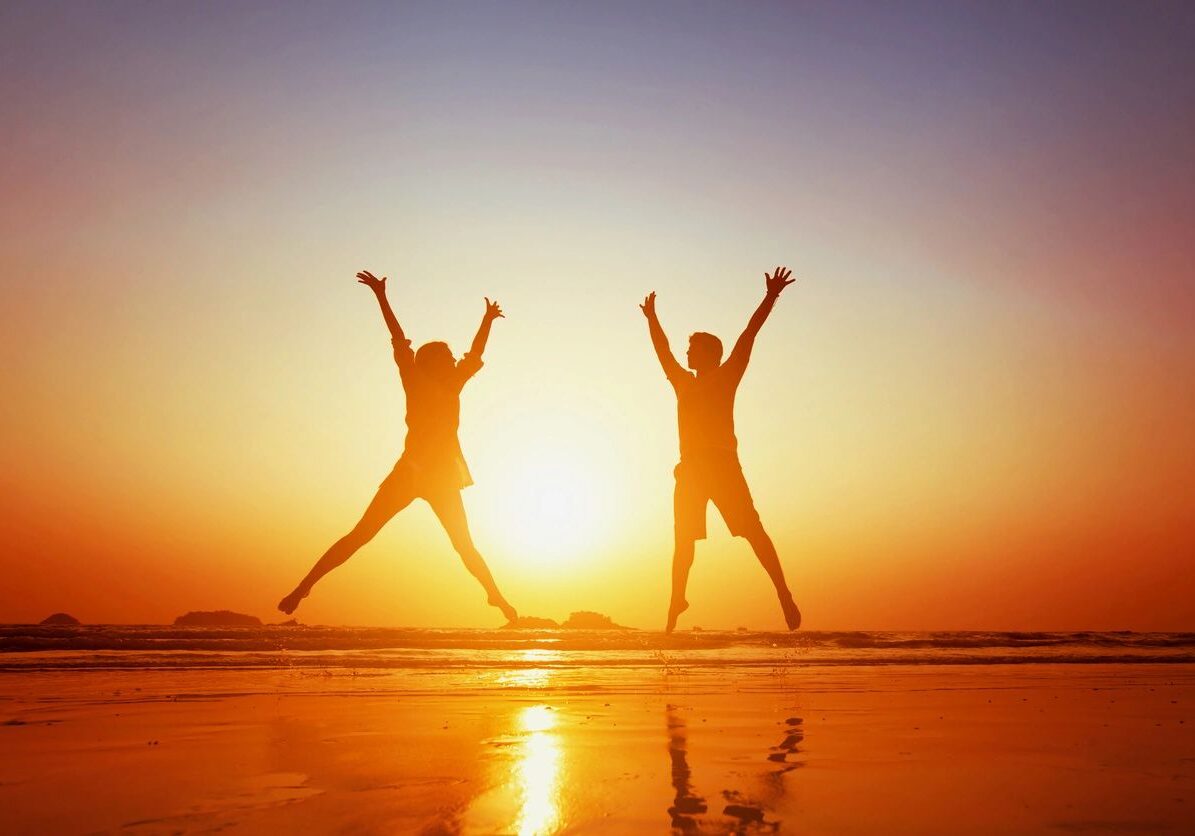 Two people walking together at sunset representing healthy relationships, support, and personal growth.